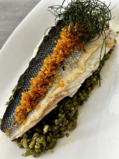 Maloles Muñoz - Lubina con risotto verde y cítricos.