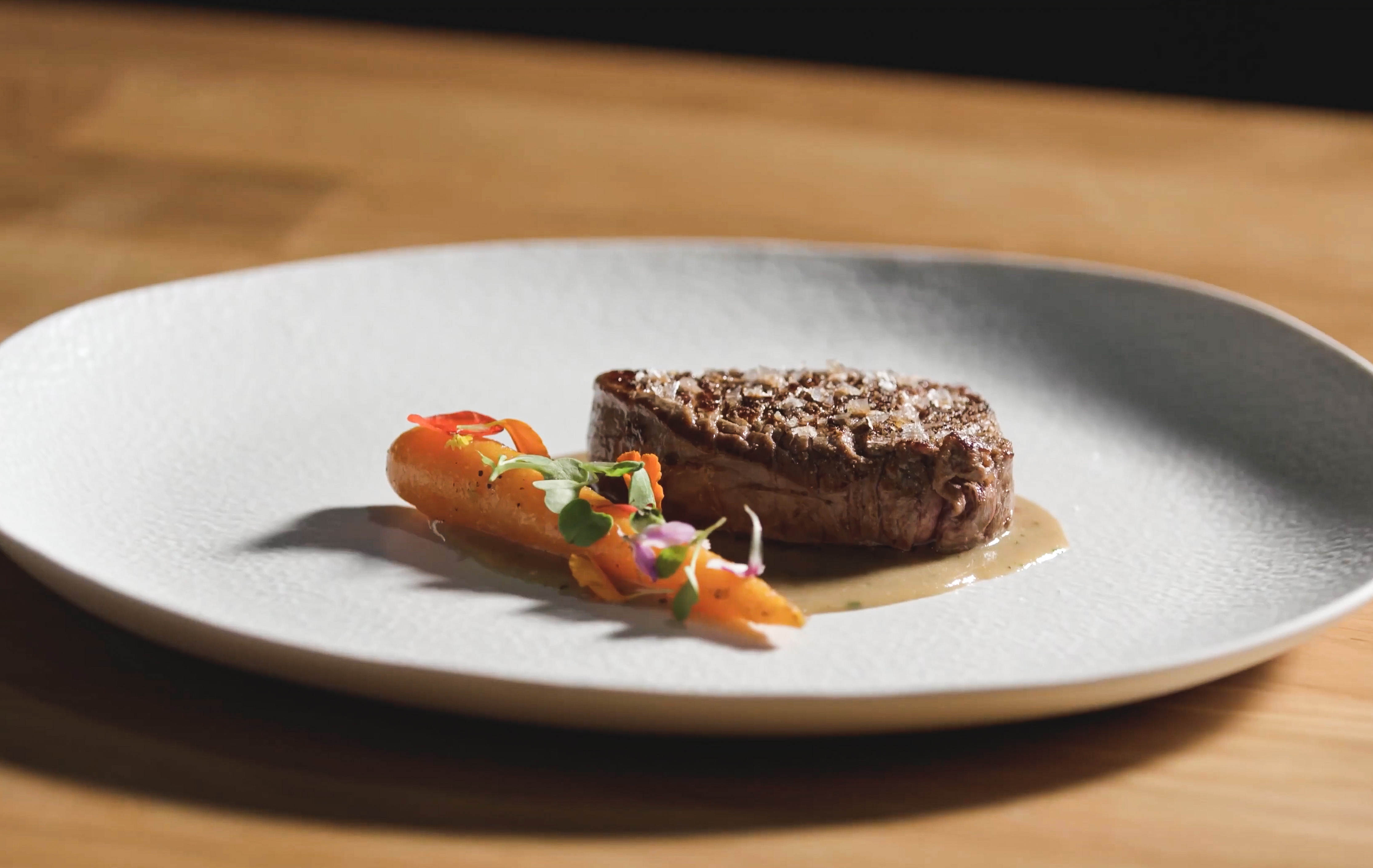 Beef tenderloin, blue cheese sauce and baby carrots