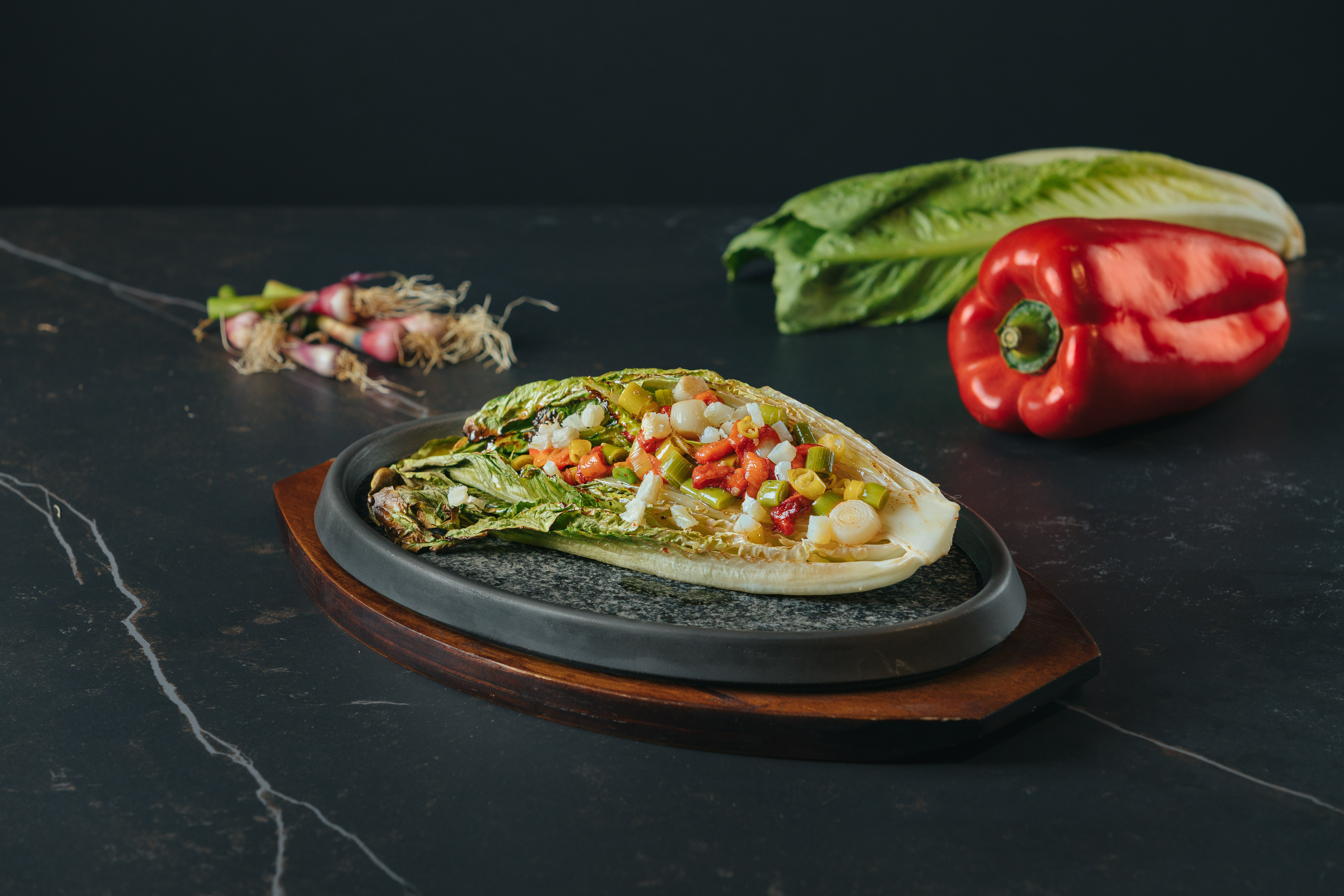 Grilled Whole Lettuce with Cod and fresh Garlic Sprouts