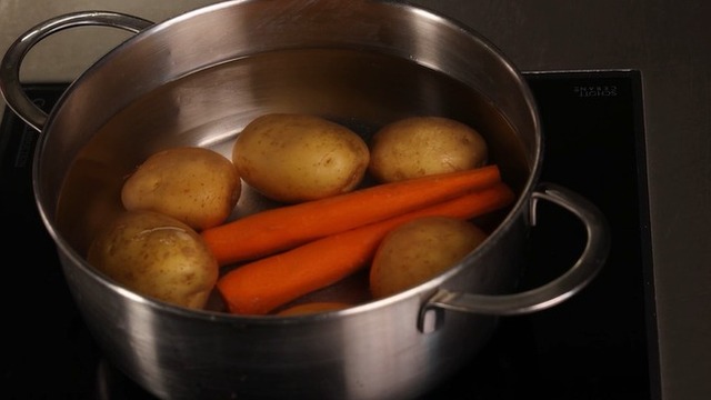 Boil potatoes and carrots from cold water