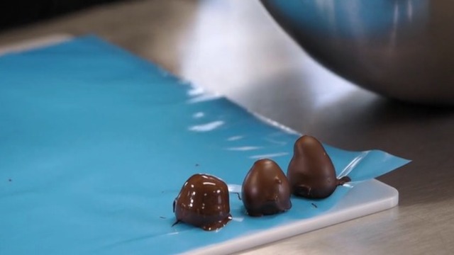 Dip truffles in tempered dark chocolate