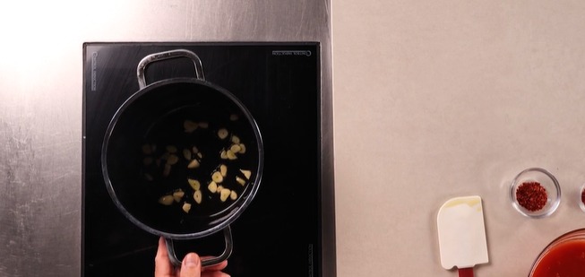 Prepare tomato and saffron broth for risotto