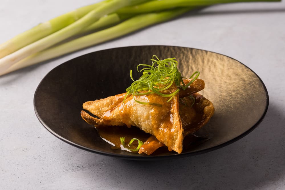 Fried Pork Wonton with Passion Fruit Kamlu Sauce and Mint